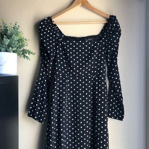 Lulu’s charmed and classy black polka dot midi dress
